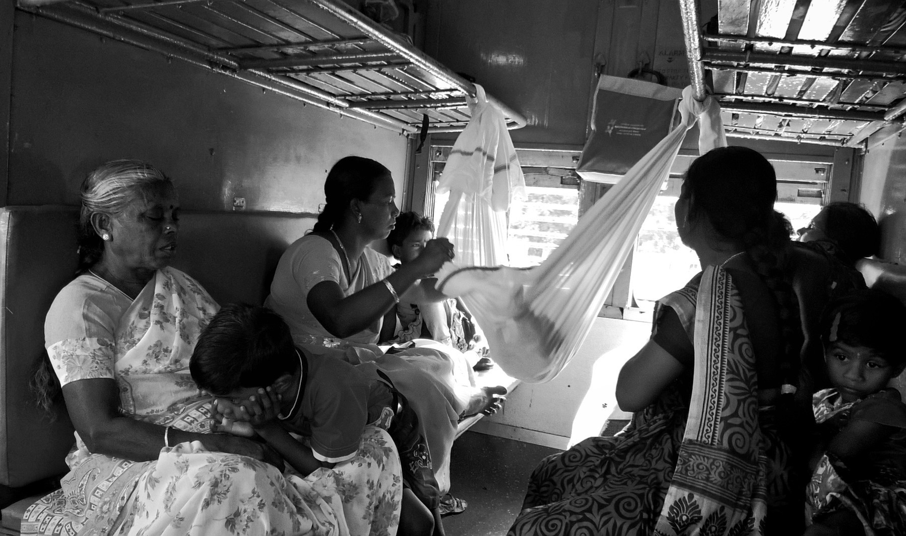 Makeshift cradle in a train coach.