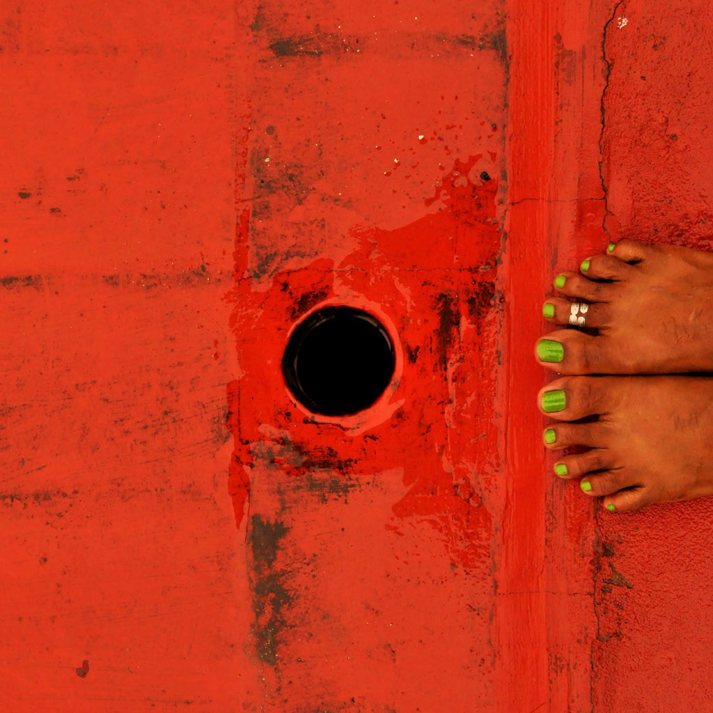 Feet on red tiled roof